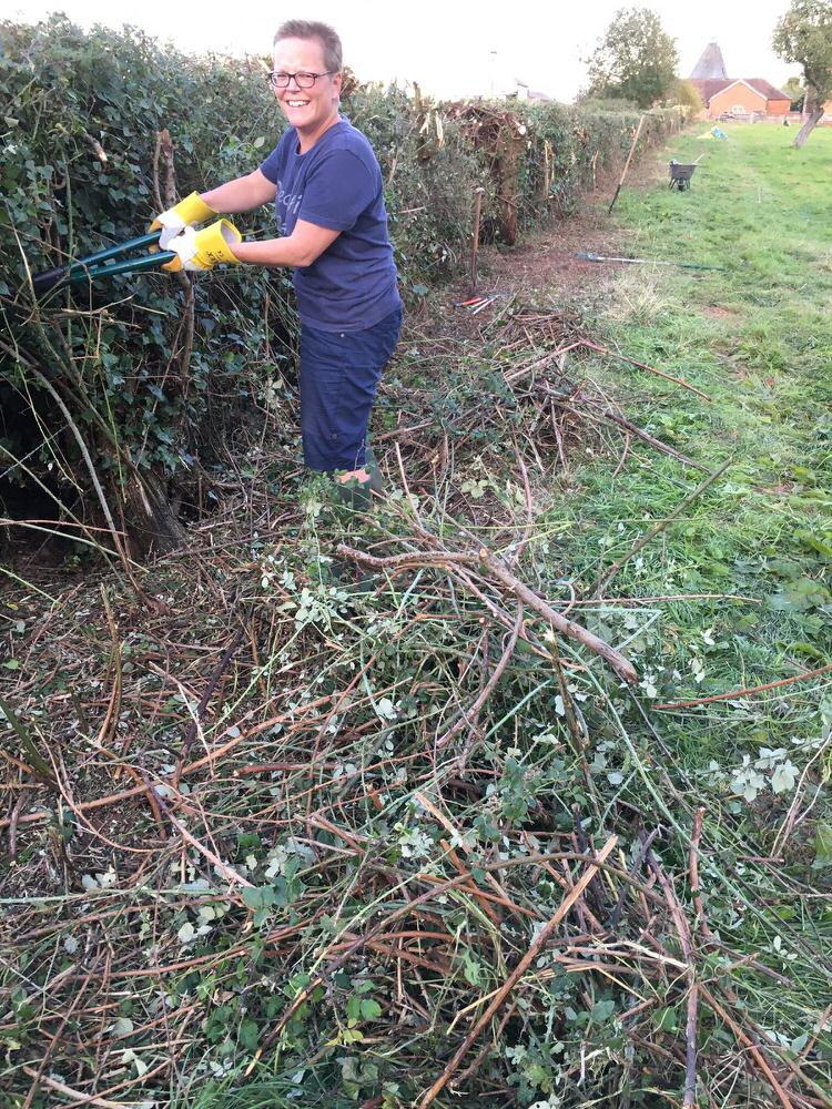 Nicky trimming the Happy Paws Outdoors hedges